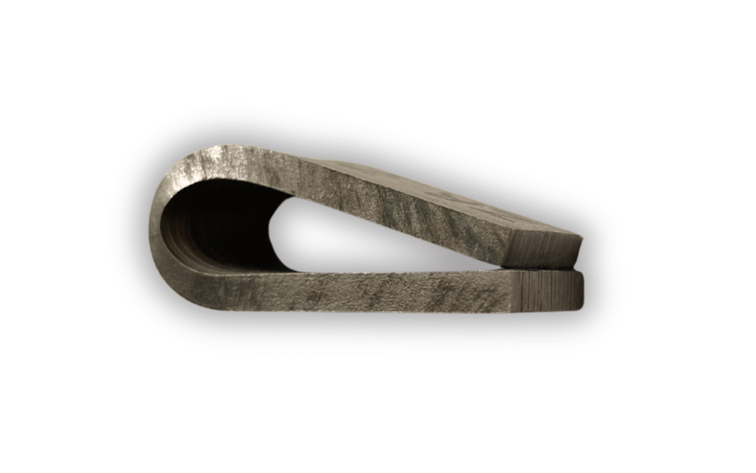 Bent explosion clad plate sample showing bond integrity