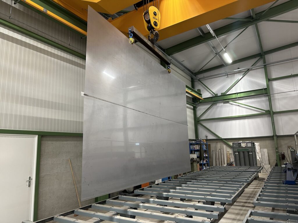 Large explosion clad plate standing upright in the Shockwave production hall